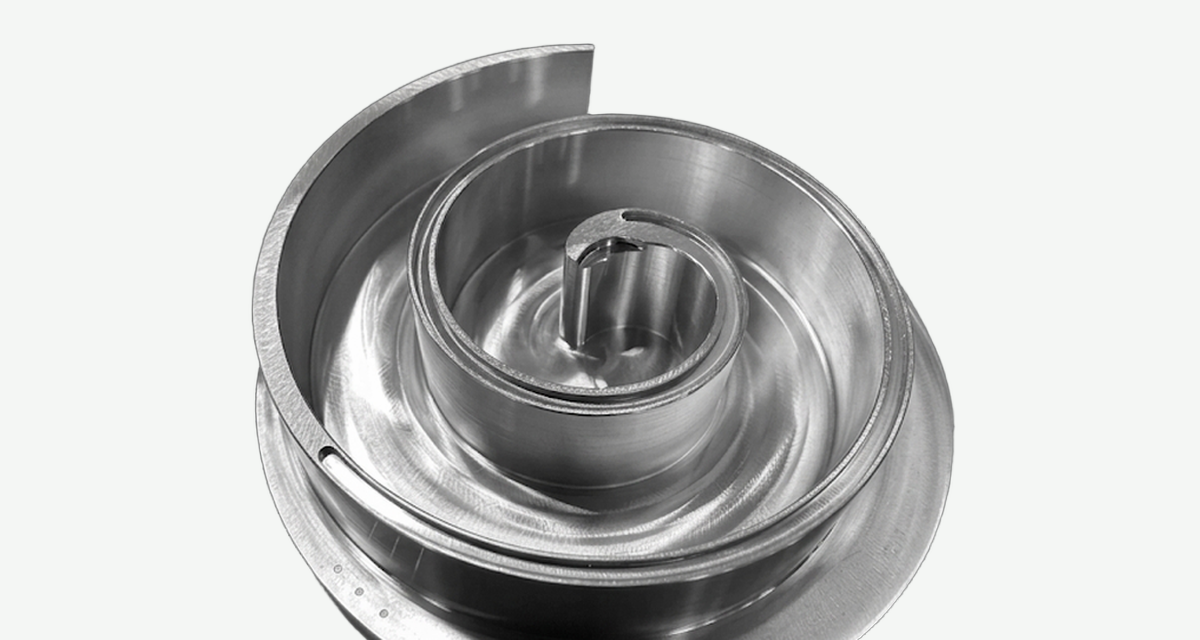 Machined metal compressor orbiting scroll with a raised spiral wall and thin base disc