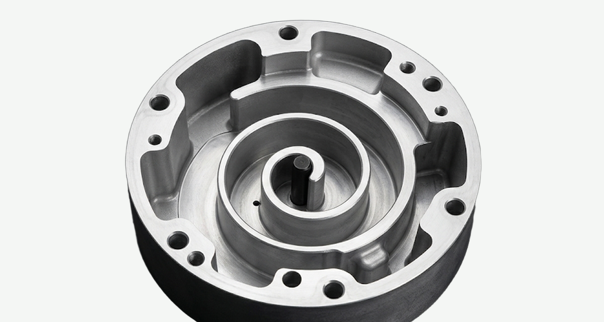Aluminum fixed-scroll compressor housing with a spiral pocket and rim bolt holes