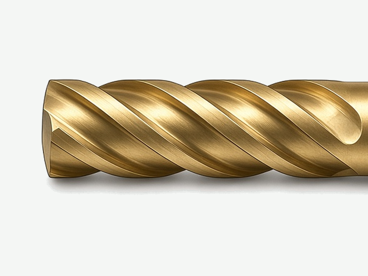 Solid carbide four-flute end mill with gold-colored coating; tip and flutes in frame, shank exits display edge; light gray background